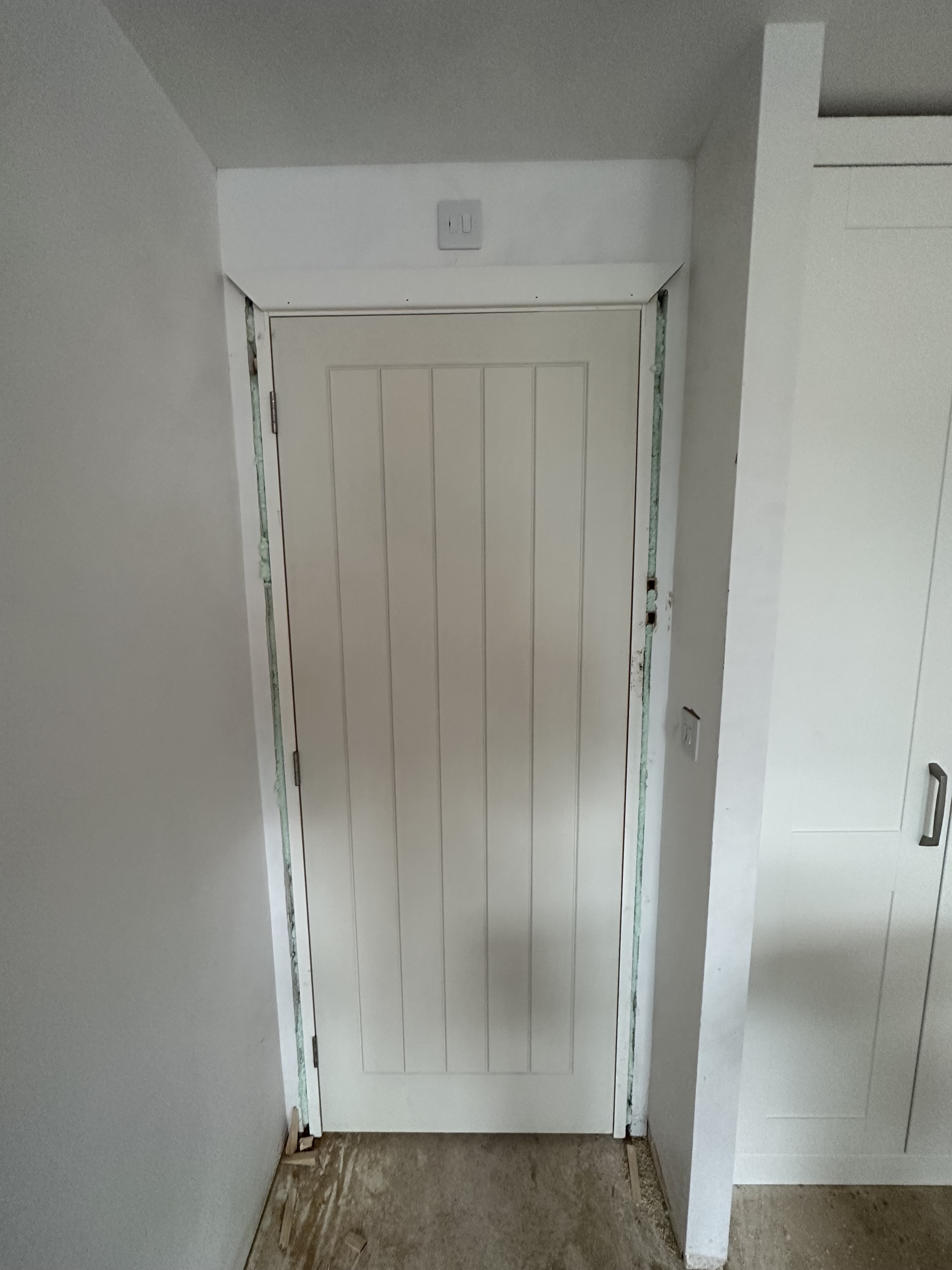 Fitted panelled door and cabinetry